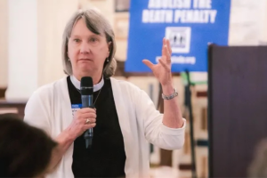 Photo of Carole Maddux speaking on Georgia Criminal Justice Reform